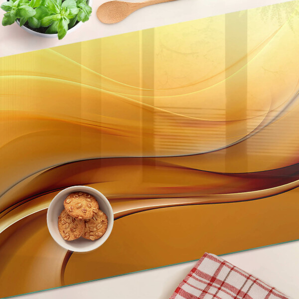 Glas schneidebrett Wellen in Goldtönen