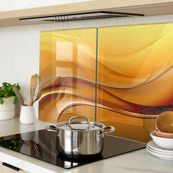 Glas Schneidebrett mit Wellen in Goldtönen