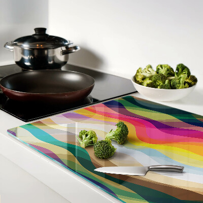 Glas-Schneidebrett mit abstrakten Farbwellen als Motiv