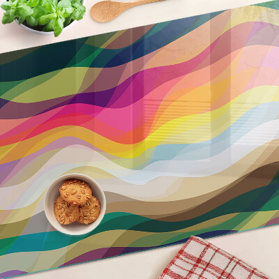 Glas-Schneidebrett mit abstrakten Farbwellen als Motiv