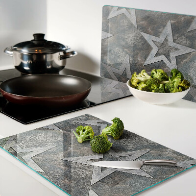 Glas schneidebrett Sterne auf strukturiertem Hintergrund