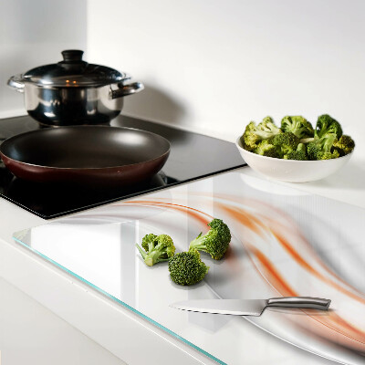 Schneidebrett mit Wellenmuster in Orange- und Grautönen