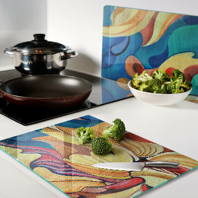 Schneidebrett Glas mit bunten Blumen auf abstraktem Hintergrund