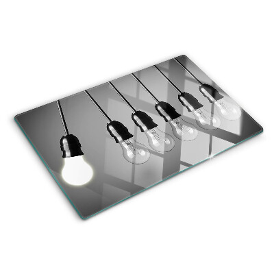 Schneidebrett mit Motiv von Glühbirnen an Kabeln