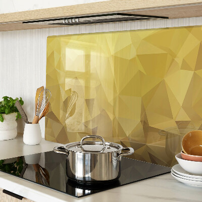 Glas-Schneidebrett mit geometrischem Muster in Goldtönen