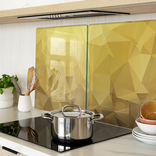 Glas-Schneidebrett mit geometrischem Muster in Goldtönen