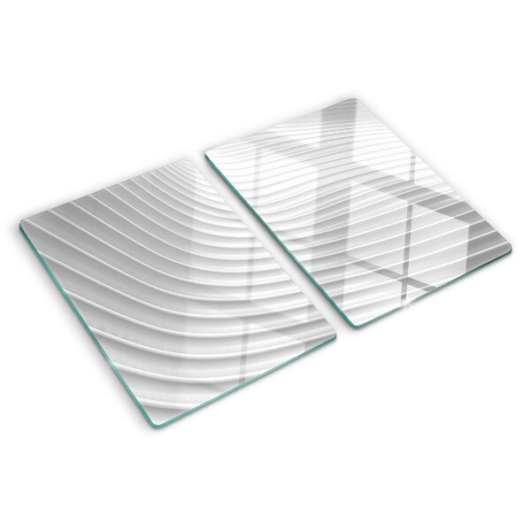 Glas-Schneidebrett mit Wellen- und Linienmotiv in Grautönen