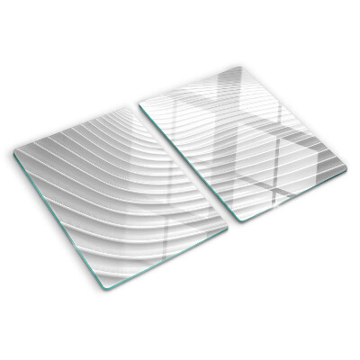 Glas-Schneidebrett mit Wellen- und Linienmotiv in Grautönen