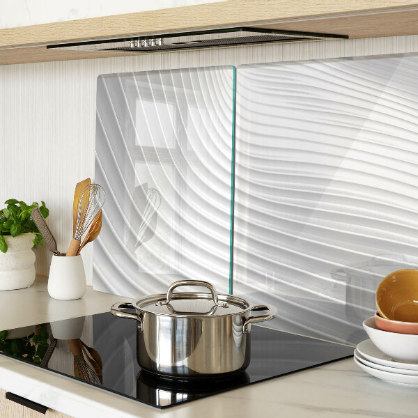 Glas-Schneidebrett mit Wellen- und Linienmotiv in Grautönen