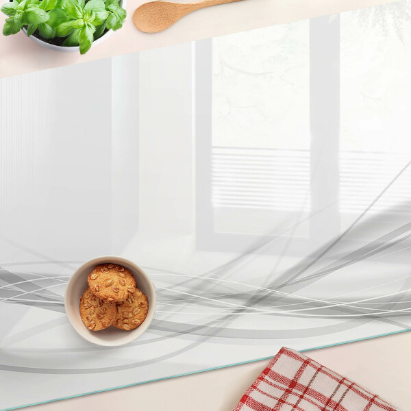 Schneidebrett Glas mit abstrakten Linien- und Wellenmotiven