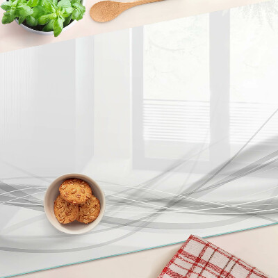 Schneidebrett Glas mit abstrakten Linien- und Wellenmotiven