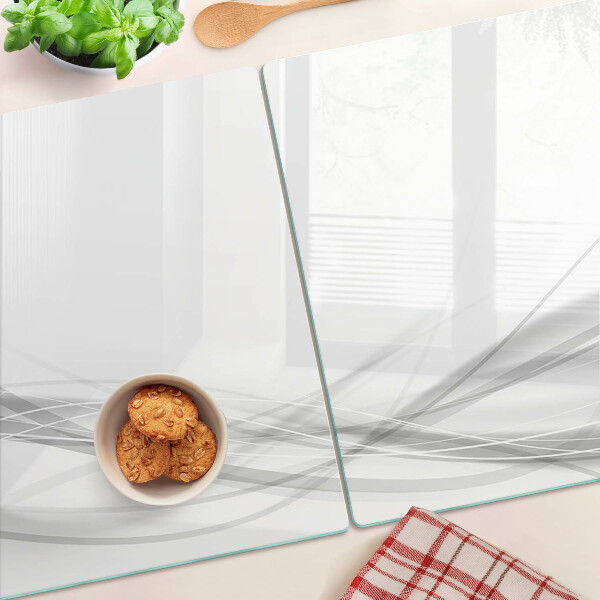 Schneidebrett Glas mit abstrakten Linien- und Wellenmotiven