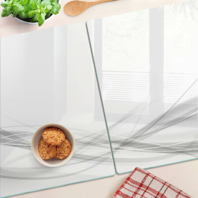 Schneidebrett Glas mit abstrakten Linien- und Wellenmotiven