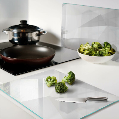 Glas-Schneidebrett mit geometrischem Muster in Grautönen