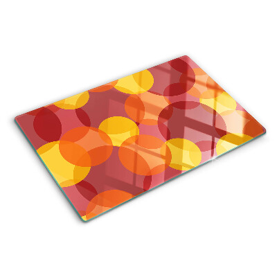 Schneidebrett Glas mit bunten Kreisen in warmen Tönen