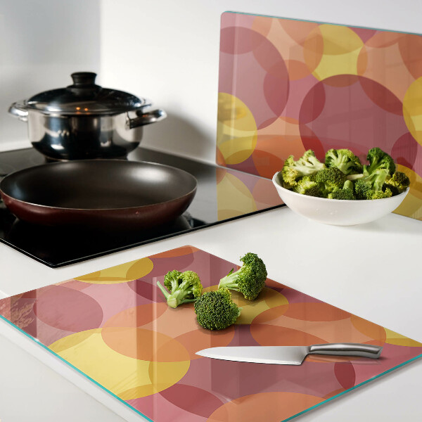 Schneidebrett Glas mit bunten Kreisen in warmen Tönen