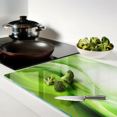 Glas-Schneidebrett mit grünen Wellen und dezenten Farbverläufen