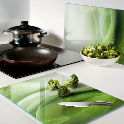 Glas-Schneidebrett mit grünen Wellen und dezenten Farbverläufen