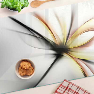 Schneidebrett mit floral-abstraktem Motiv und dynamischen Linien