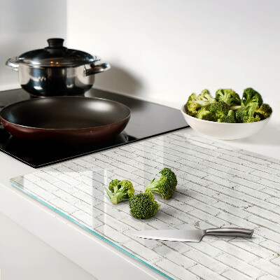 Schneidebrett Glas mit Motiv einer weißen Backsteinmauer