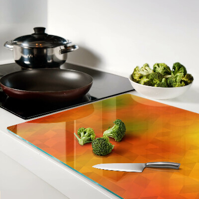 Glas-Schneidebrett mit geometrischem Muster in Orangetönen