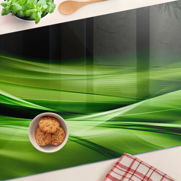 Schneidebrett mit grünem abstraktem Wellenmotiv