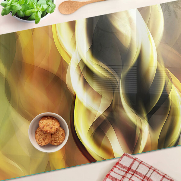 Schneidebrett Glas mit abstrakten Wellen in Goldtönen