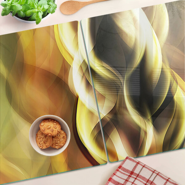 Schneidebrett Glas mit abstrakten Wellen in Goldtönen