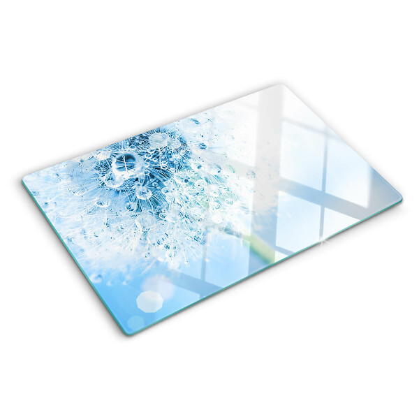 Glas schneidebrett Löwenzahnblüte mit Wassertropfen