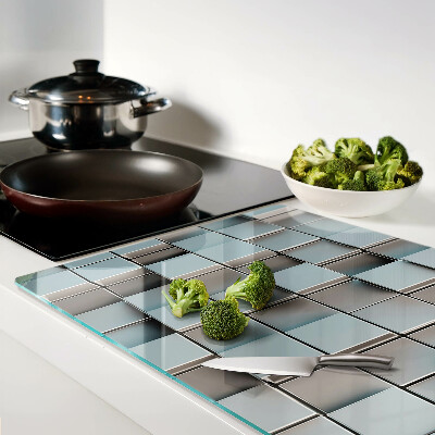 Schneidebrett mit Motiv aus geometrischen Fliesen in Blautönen