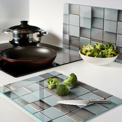 Schneidebrett mit Motiv aus geometrischen Fliesen in Blautönen