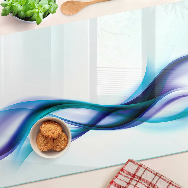 Schneidebrett Glas mit Wellenmotiven in Blau- und Türkistönen