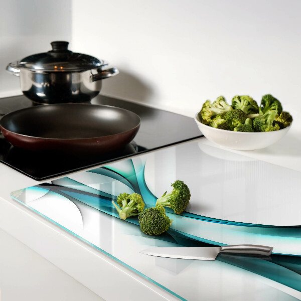 Glas-Schneidebrett mit wellenförmigem Muster in Blautönen