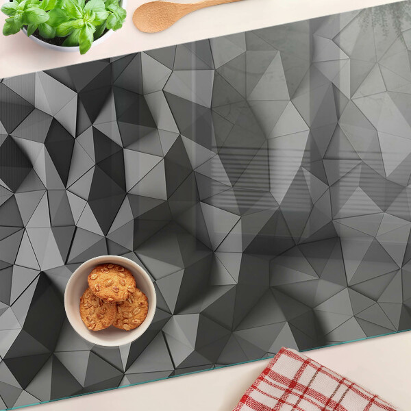 Glas-Schneidebrett mit abstraktem geometrischem Muster in Grautönen