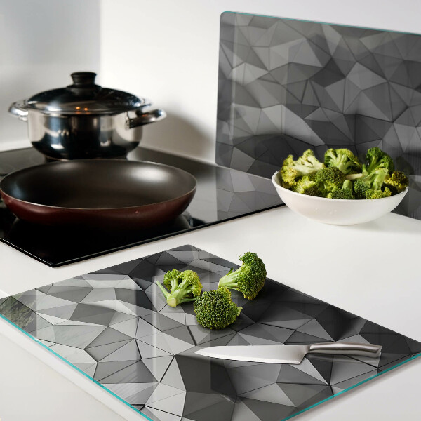 Glas-Schneidebrett mit abstraktem geometrischem Muster in Grautönen