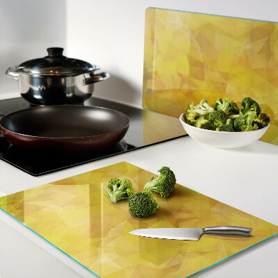 Schneidebrett Glas mit gelbem geometrischem Mosaik