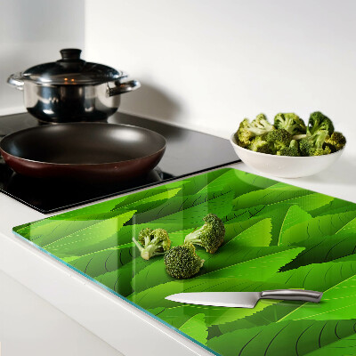 Schneidebrett Glas mit Blattmotiven in Grüntönen