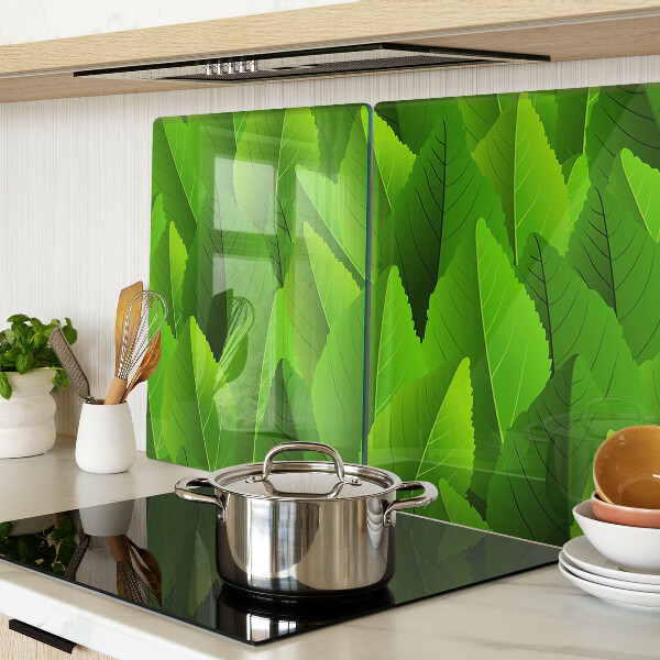 Schneidebrett Glas mit Blattmotiven in Grüntönen