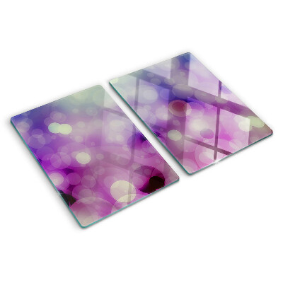 Glas-Schneidebrett mit Bokeh-Motiv in Lila- und Rosatönen