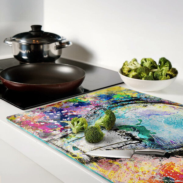 Schneidebrett mit Motiv einer Glühbirne auf farbigem Hintergrund