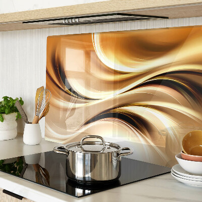 Glas-Schneidebrett mit abstraktem Wellenmotiv in Goldtönen