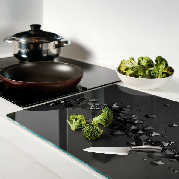 Schneidebrett glas Schwarze Kristalle im Hintergrund