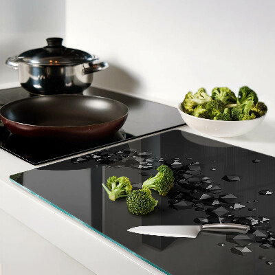 Schneidebrett glas Schwarze Kristalle im Hintergrund