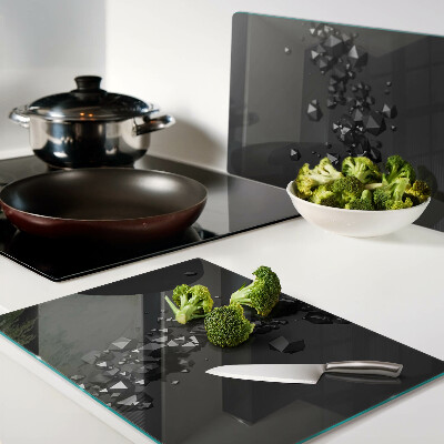 Schneidebrett Glas mit schwarzem Kristallmuster im Hintergrund