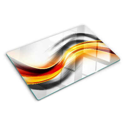 Glas-Schneidebrett mit Wellenmotiv in Orange und Schwarz