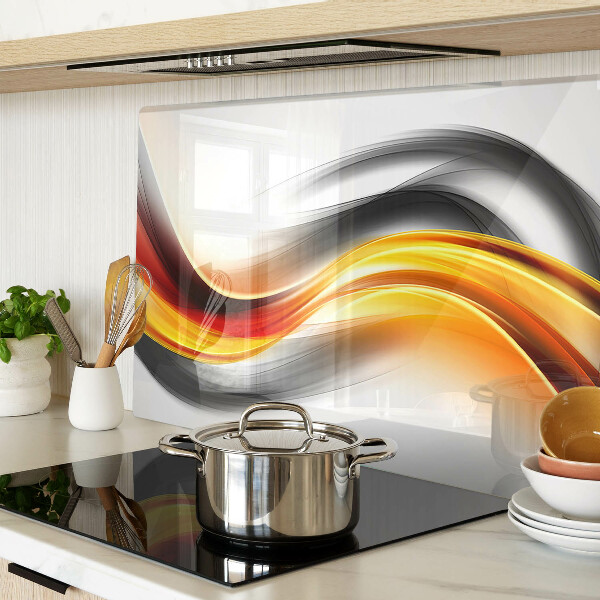 Glas-Schneidebrett mit Wellenmotiv in Orange und Schwarz