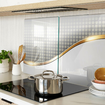 Schneidebrett glas Eine goldene Welle auf einem Hintergrund aus Punkten