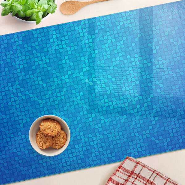 Glas schneidebrett Ein wellenförmiges Muster in Blautönen