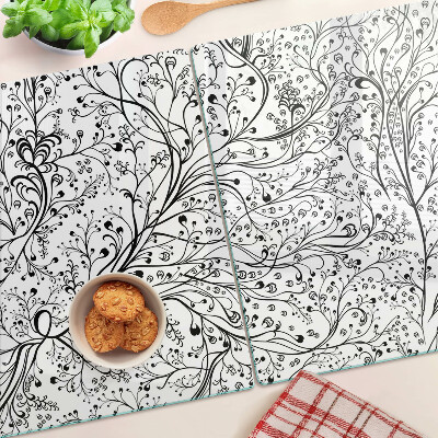 Glas Schneidebrett mit Pflanzenmuster und zarten Zweigen