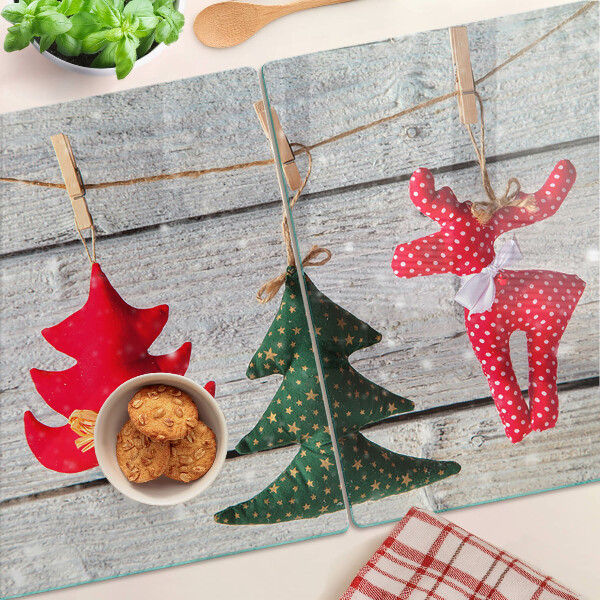 Schneidebrett mit Weihnachtsdekorationen auf Holzoptik